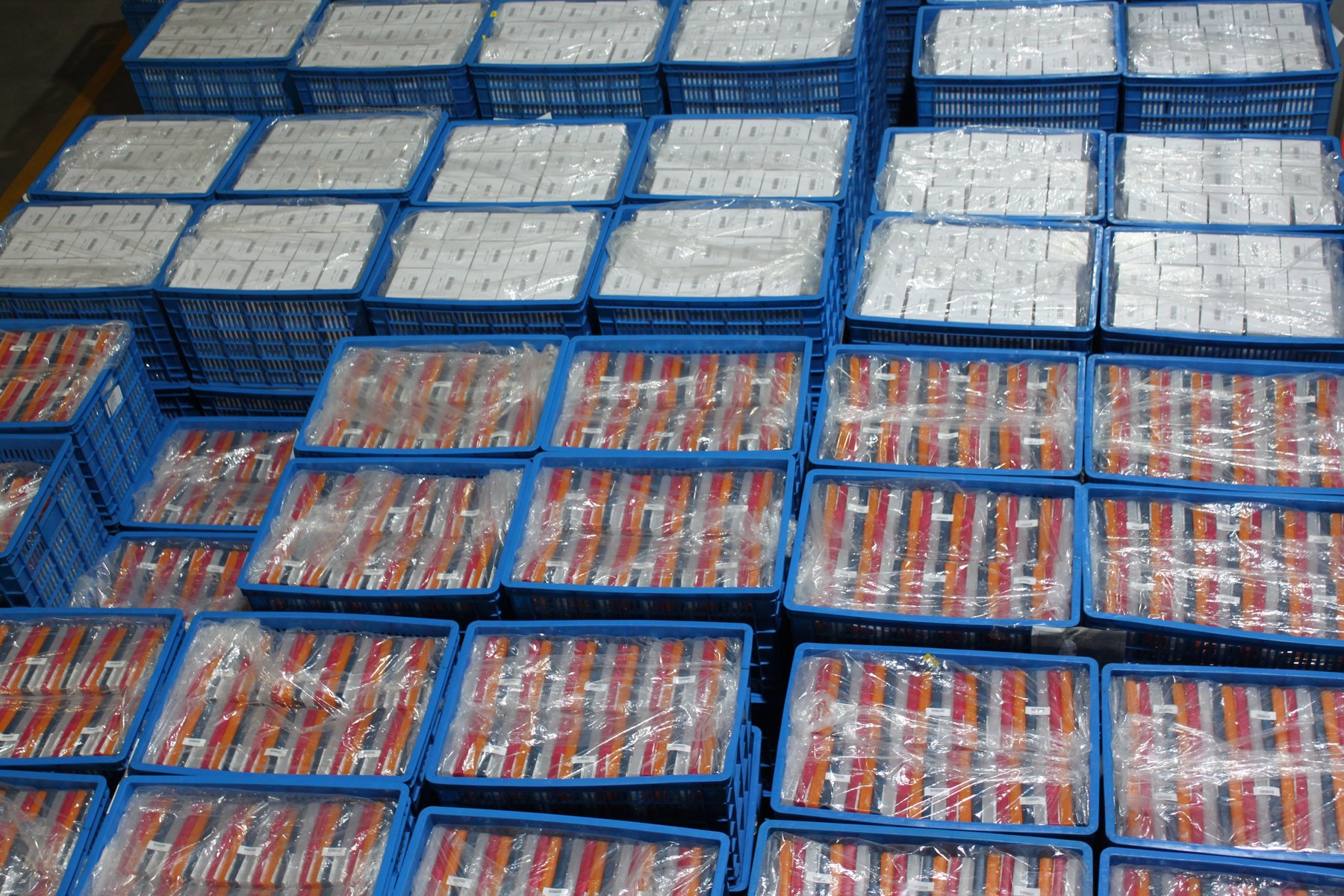 Finished molded parts bagged and crated for shipment