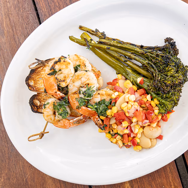 A plate of food on a wooden table.
