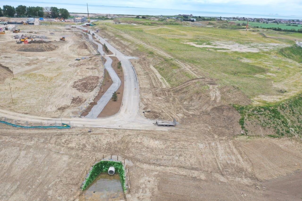 Aerial view of large-scale land development and infrastructure works.
