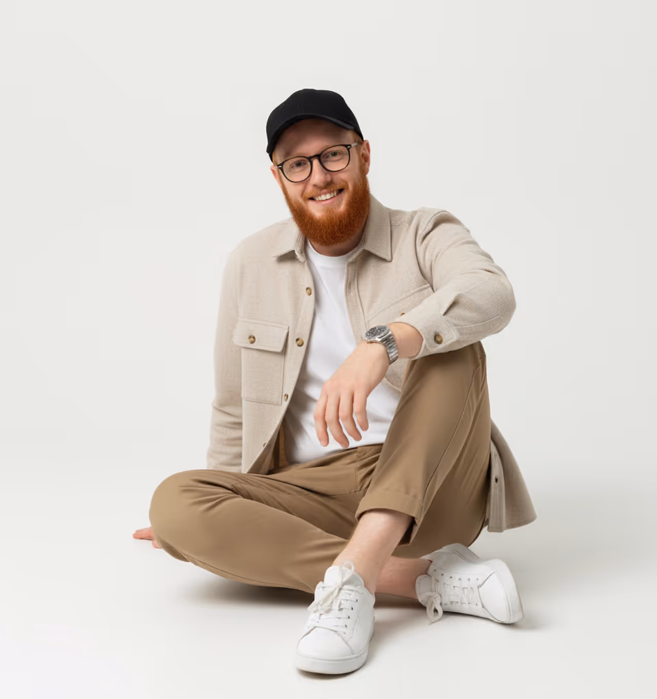 Me, a ginger designer and Webflow developer sitting casually and proving creativity runs on pixels not melanin