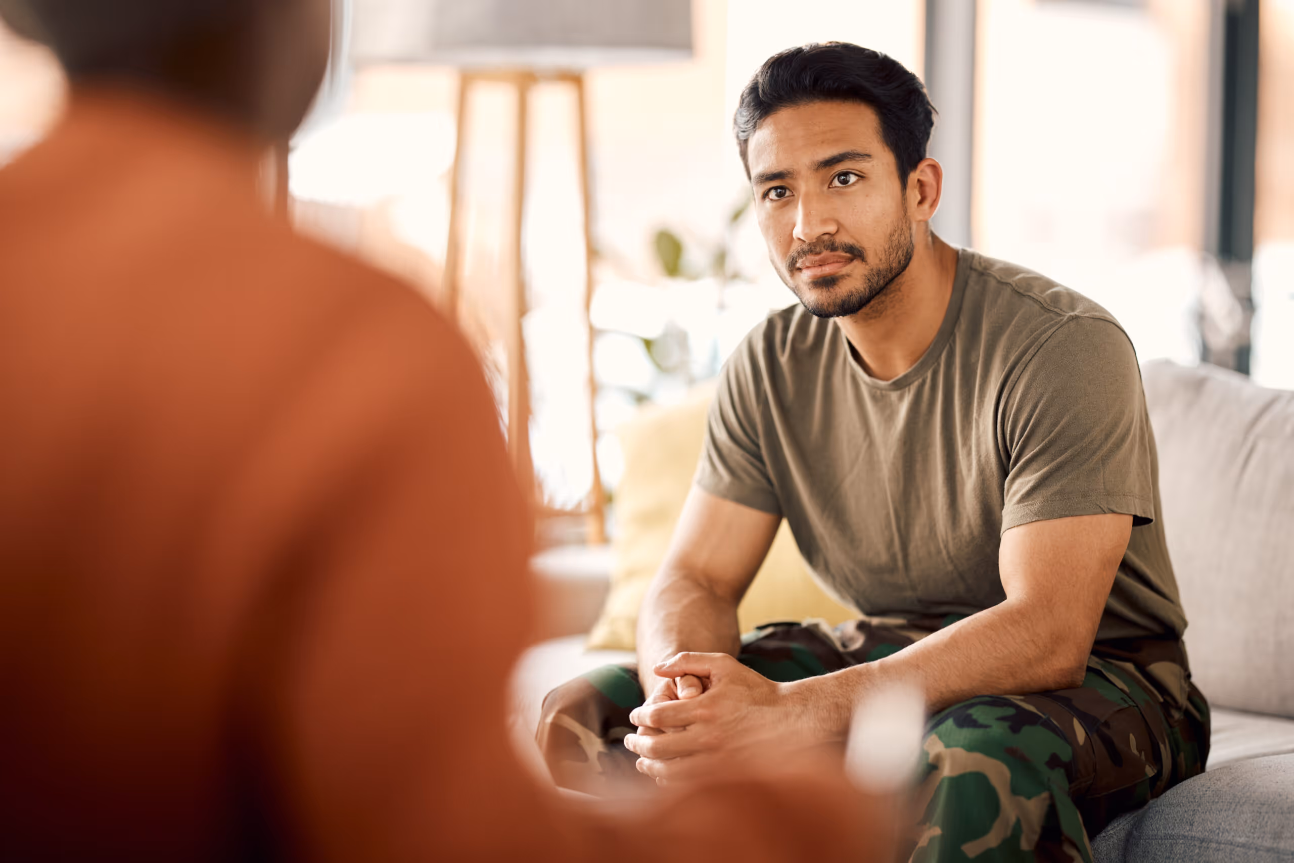 Man talking calmly in a therapy session for stress and hormone balance