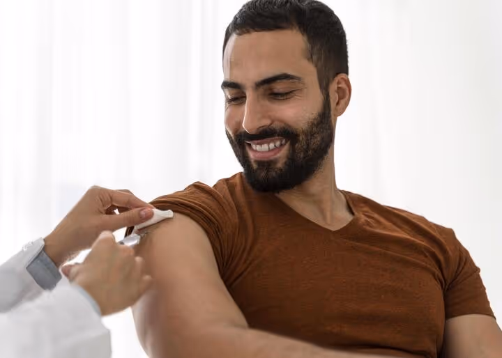 Man receiving a wellness injection in clinical setting, representing Sermorelin therapy for faster recovery and enhanced performance at Gameday Men’s Health