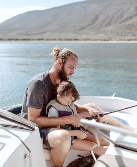 Man teaching his child to fish, representing improved energy and testosterone levels with Clomid