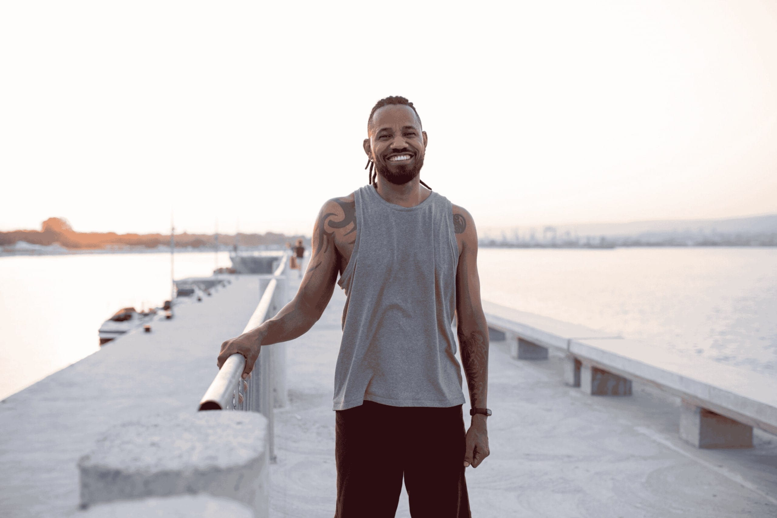 Smiling man thinking about whether testosterone can make you taller.