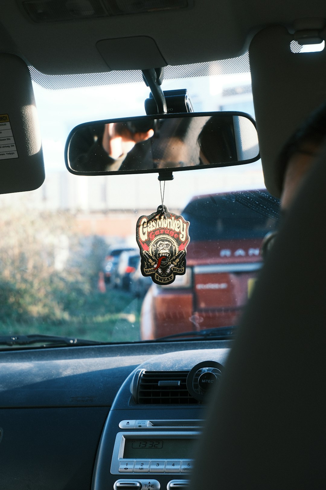 Car interior with air freshener and traffic