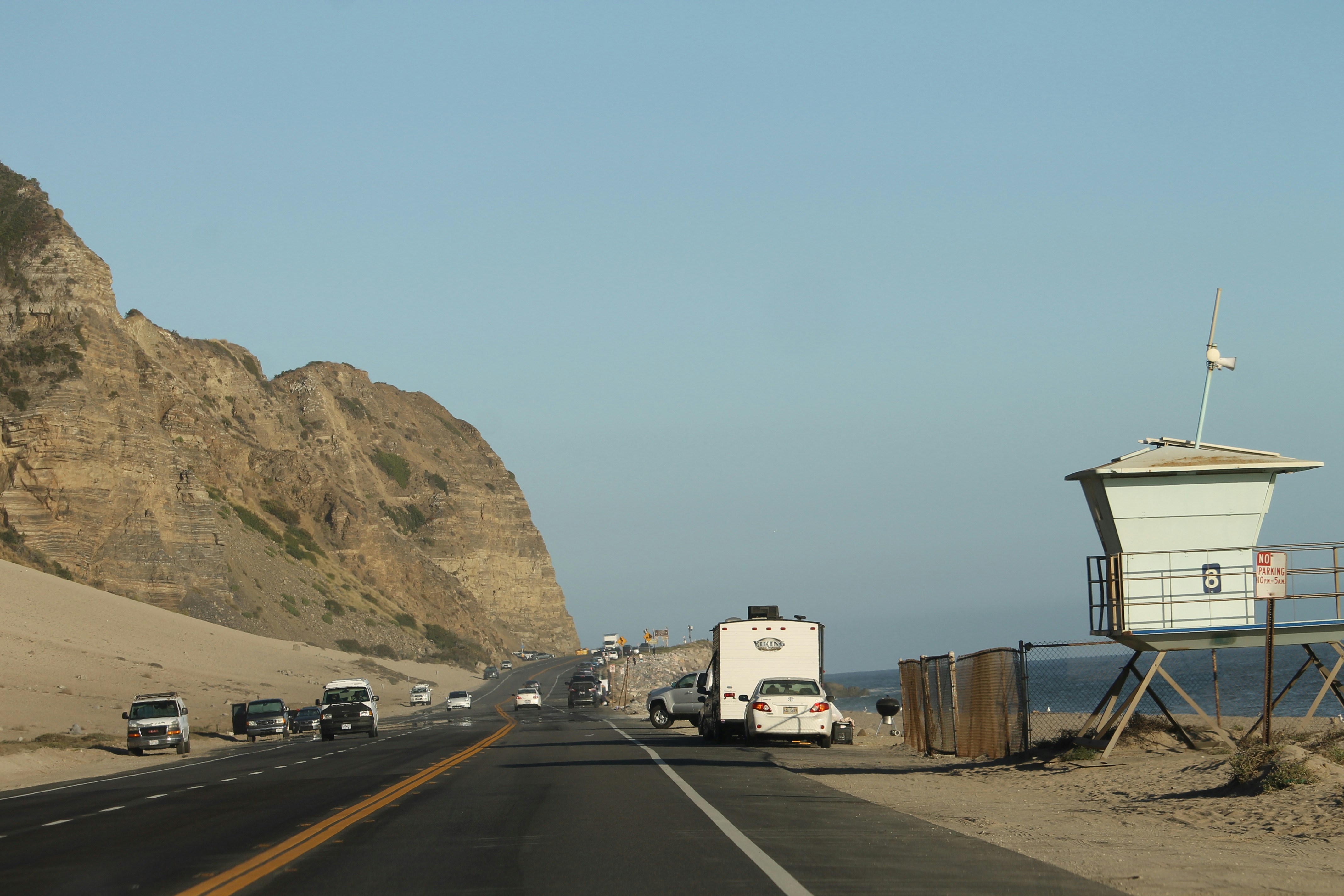 A car parked along a coastal San Diego highway