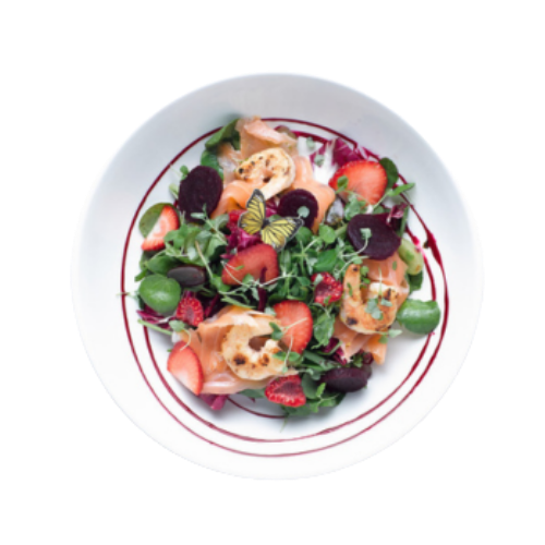 A salad bowl with a edible wafer butterfly garnish, served at Revolution Bars