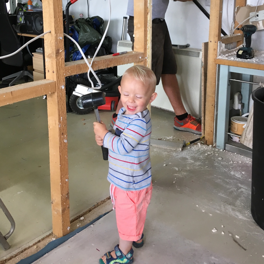 Emily & Joe's son hard at work helping build our first unit. 