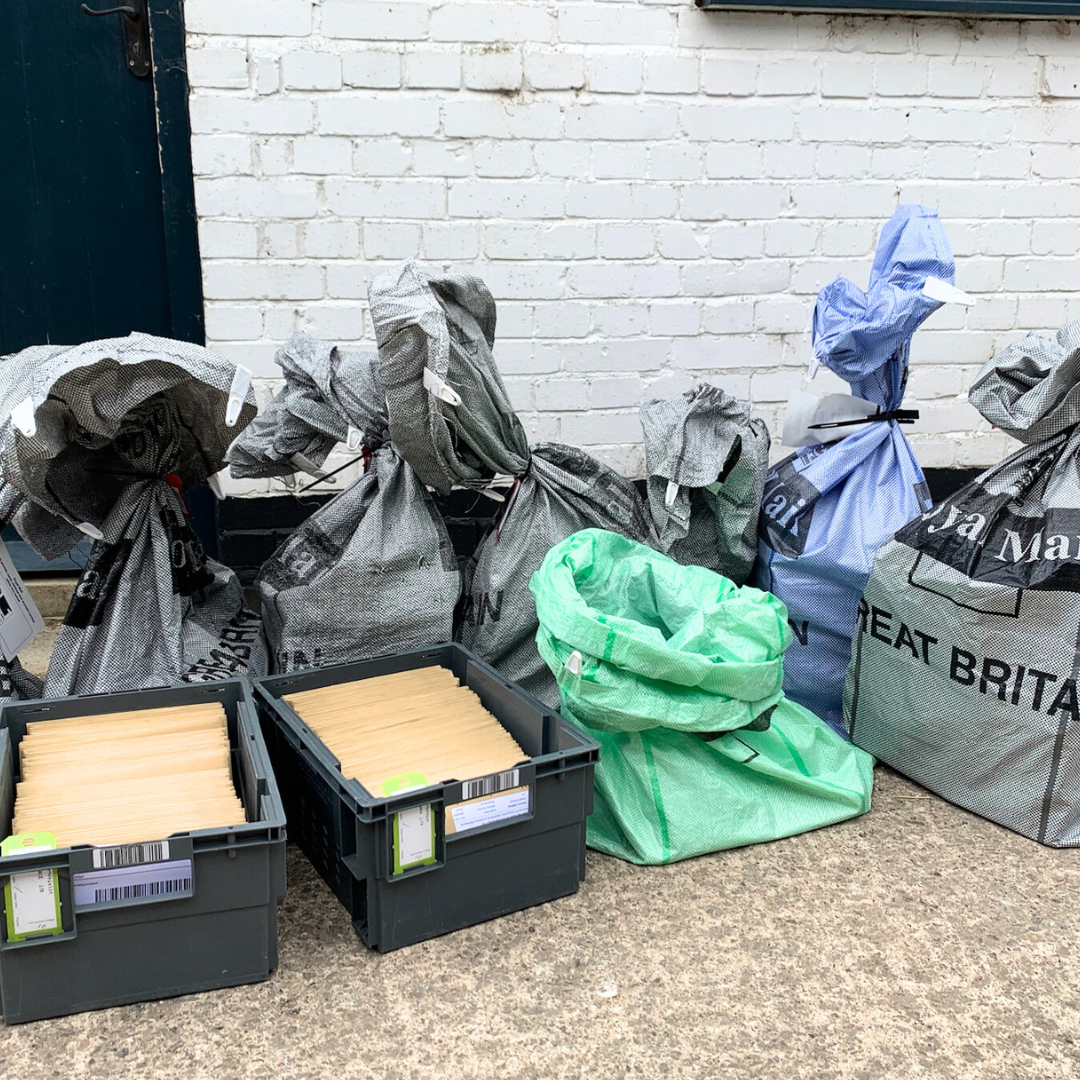 Hundreds of orders being shipped out in bags and envelopes.