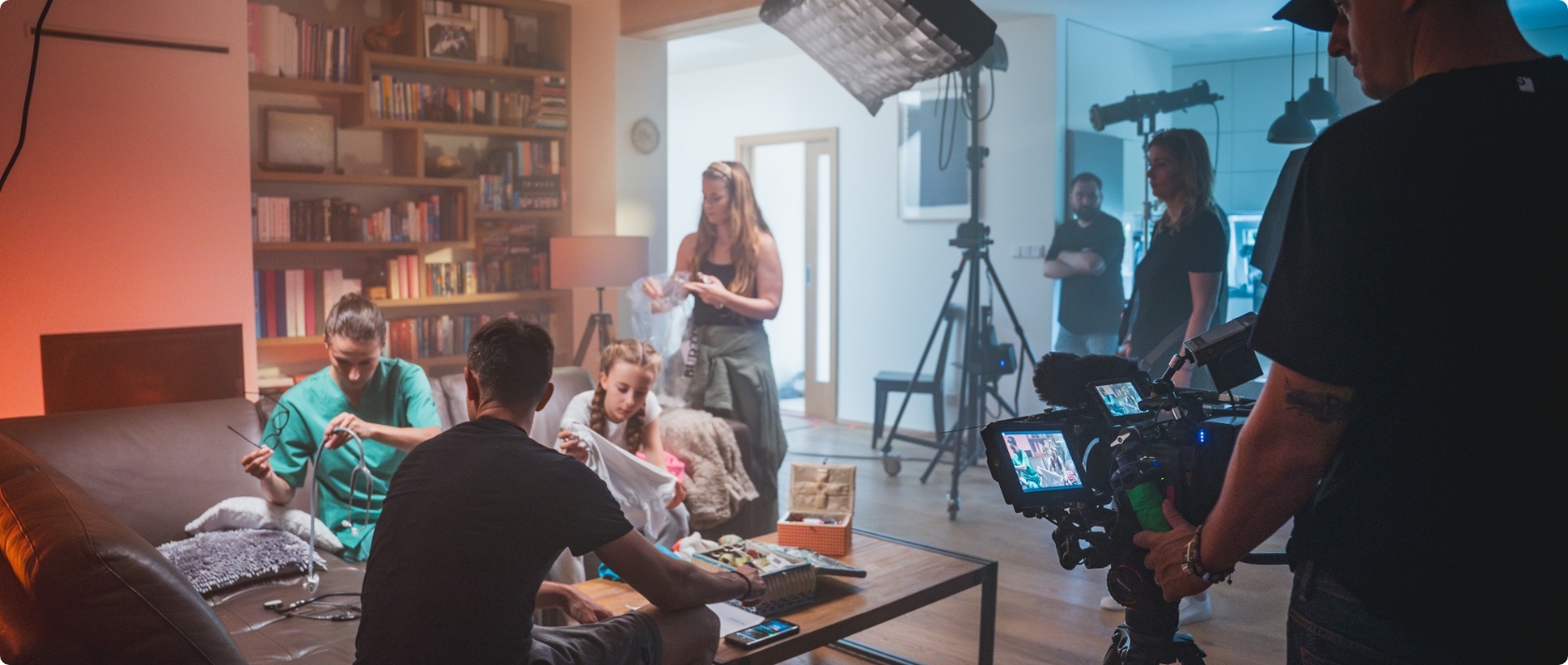 A group of people sitting around a living room.