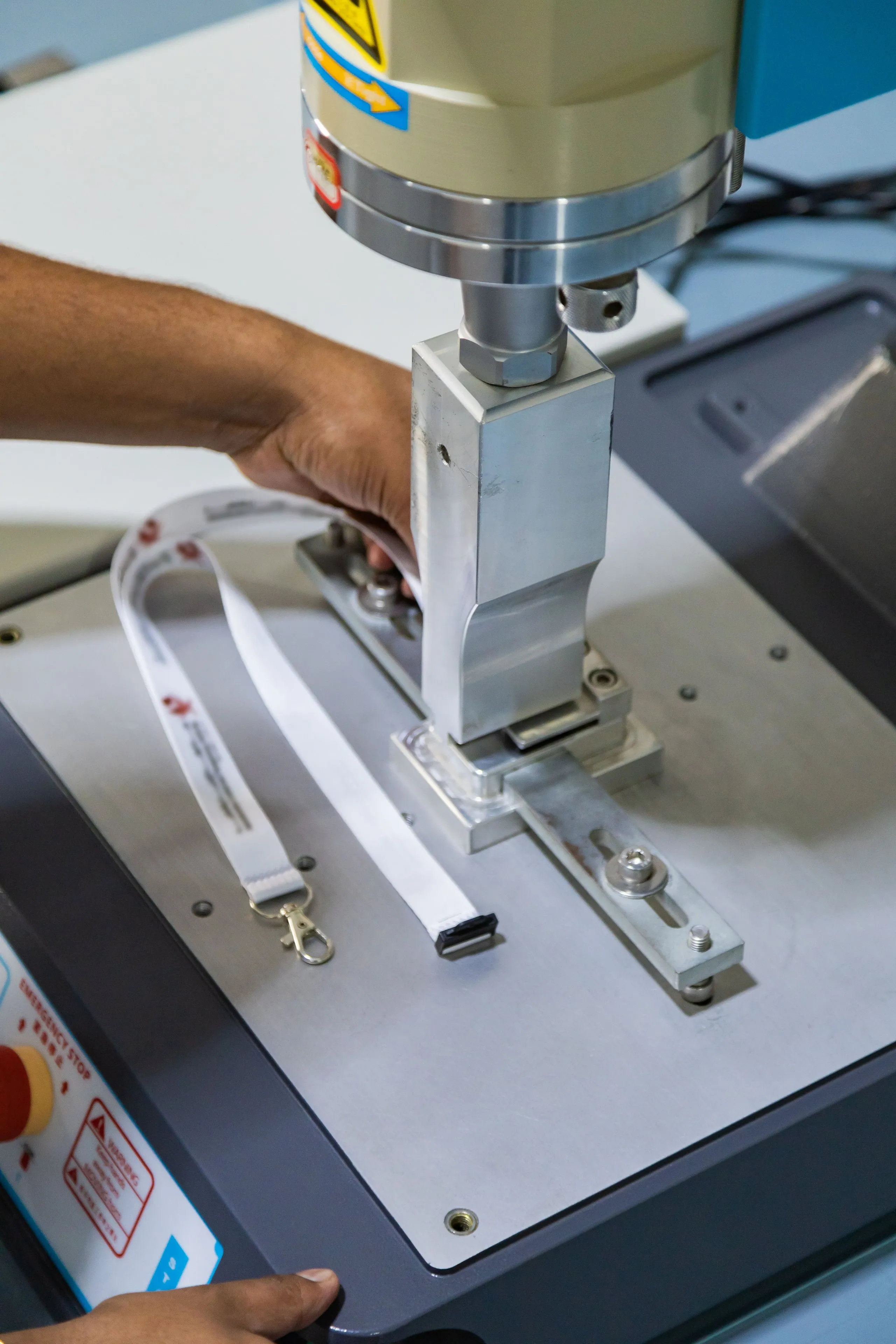 A machine in Lanyardy's workshop manufacturing custom lanyards