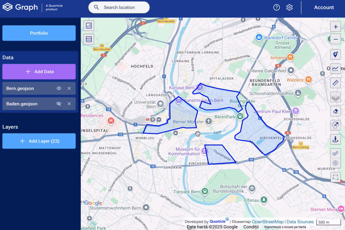 Image from Graph by Quarticle showing a detailed street map with blue polygon overlays marking specific geographic areas. The interface includes a dark blue sidebar with various mapping tools and layer controls, and the map shows streets, buildings, and geographic boundaries.