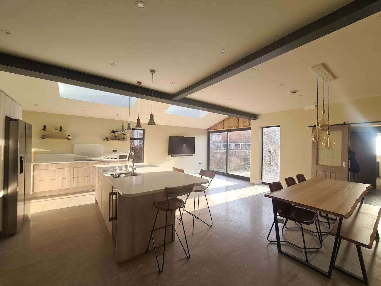 A kitchen with a newly installed polished concrete floor. 