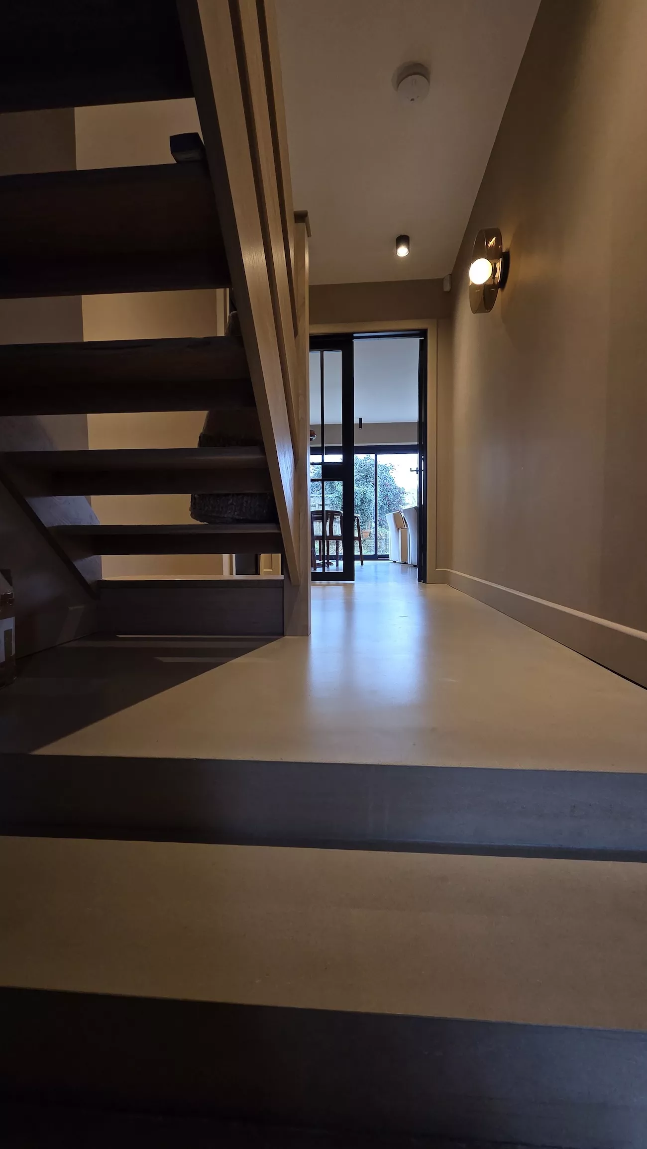 Polished concrete overlay in hallway entrance with seamless light ash brown concrete overlay flooring
