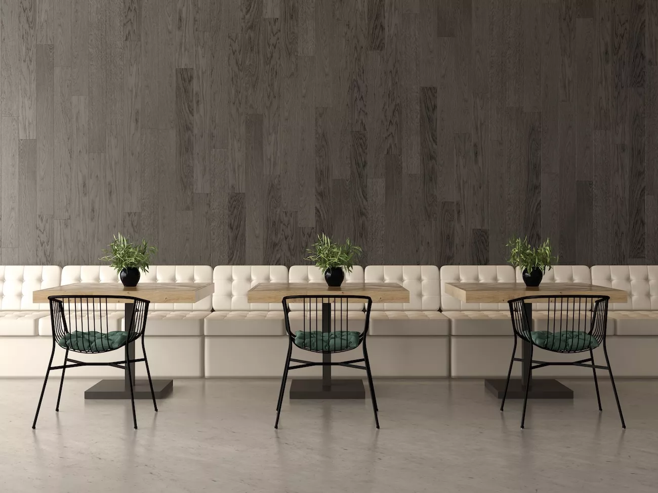 Polished concrete flooring in a modern cafe booth seating area.