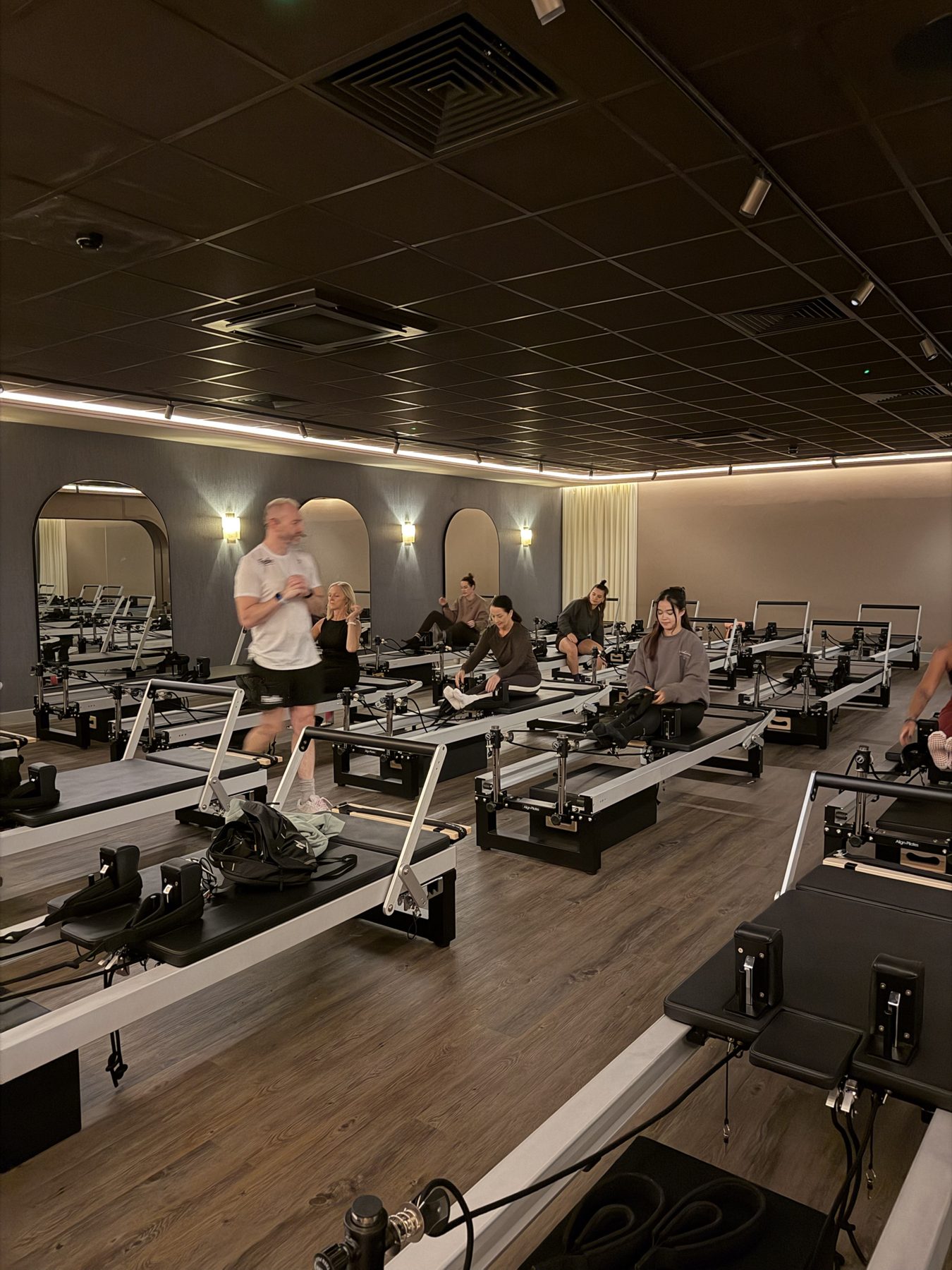 Reformer Pilates instructor training in a Pilates studio