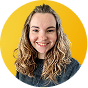 Anastasiya Shaposhnyk, a woman with long dark wavy hair wearing a light-colored top, smiling against a bright yellow circular background.