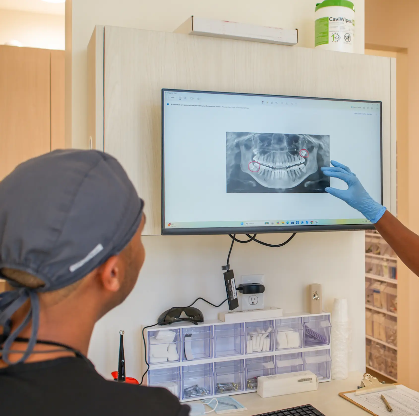 Kenner Dental Company team member showing x-ray image