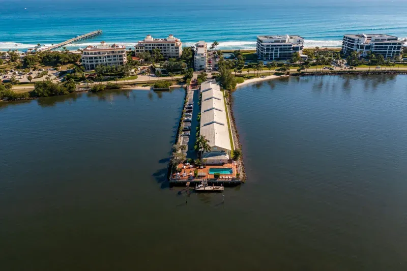 Aerial over Palm Beach Resort, Intracoastal Waterway, and Atlantic Ocean.