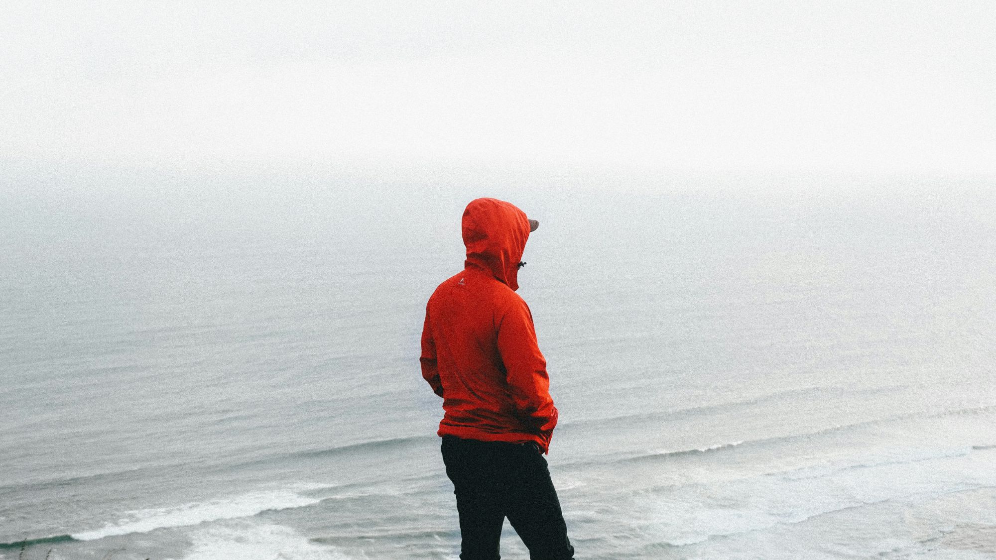 Julian Foley standing on a beach