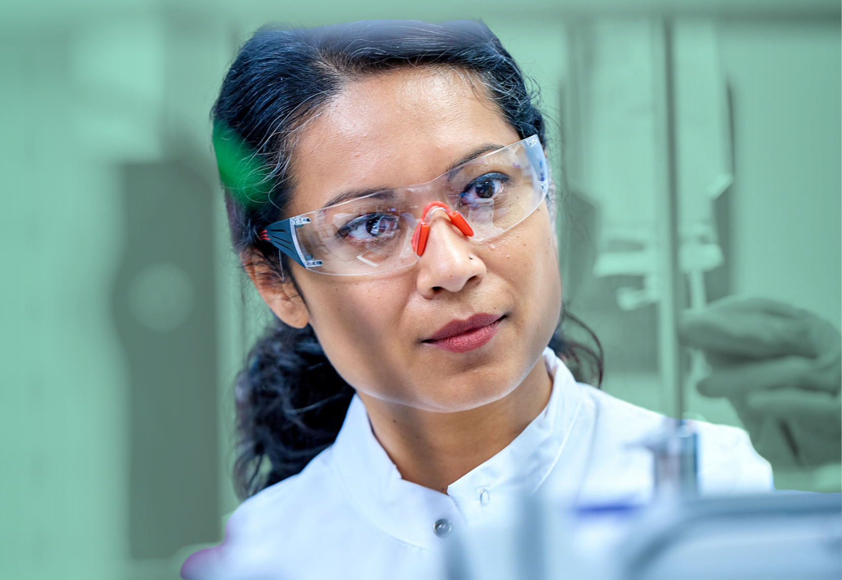 Scientist examining tube