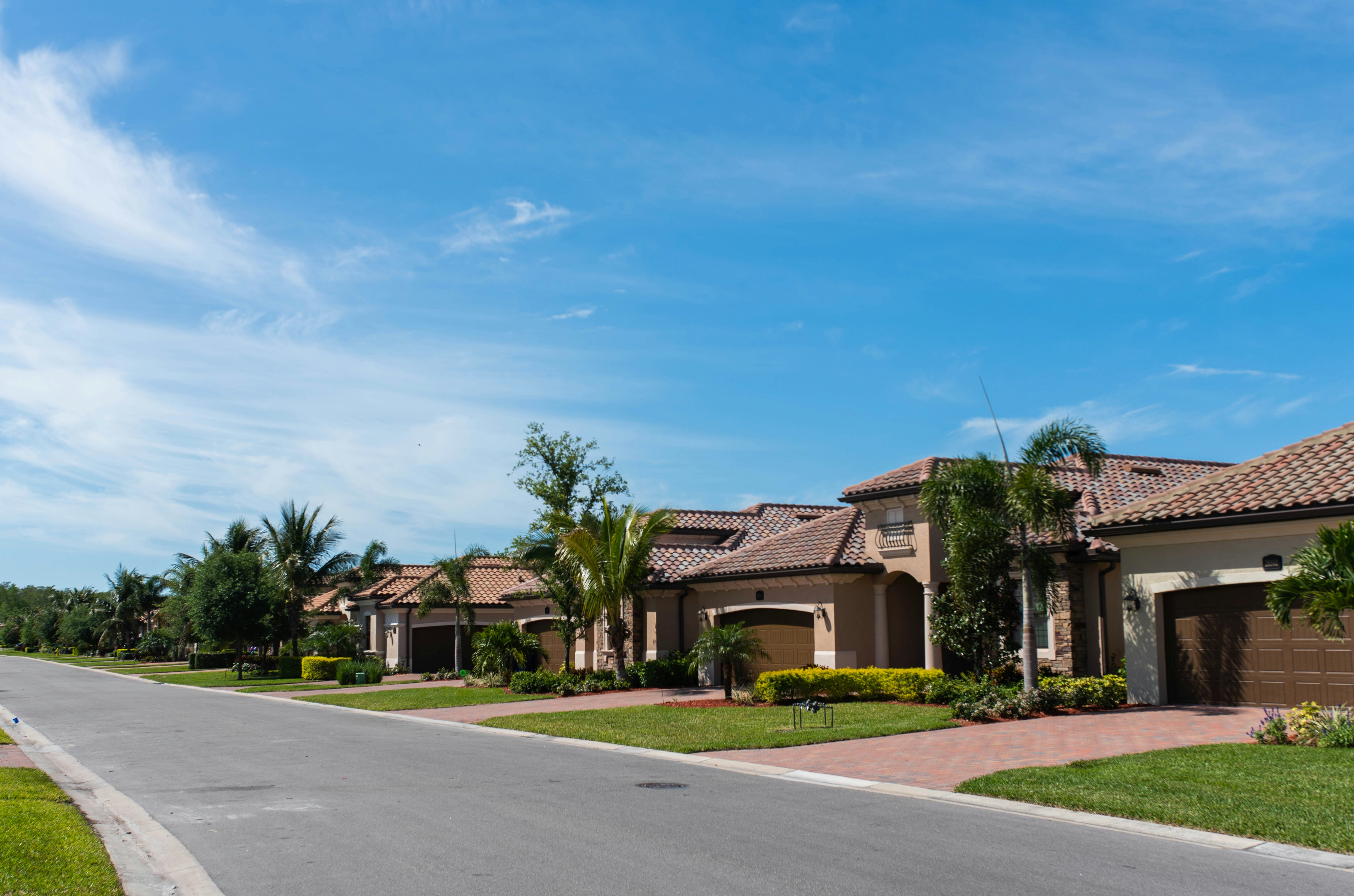 Homeowners reviewing home sale documents with agent - Maryland capital gains tax exclusion