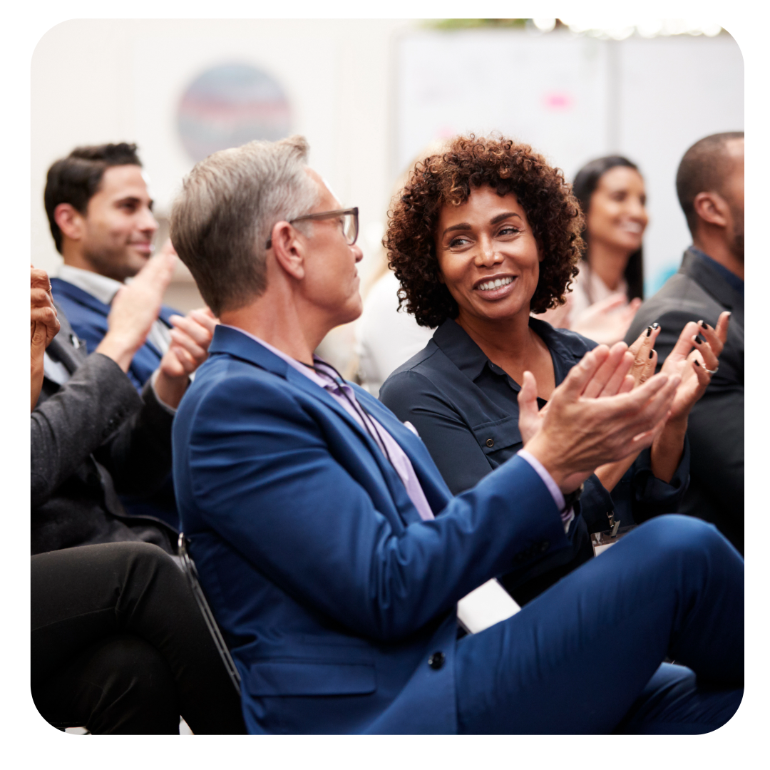Conference attendees clapping