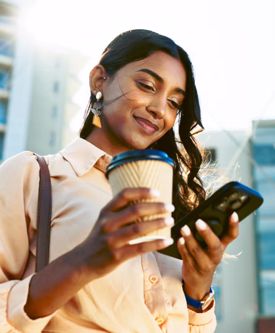 Woman on phone with coffee