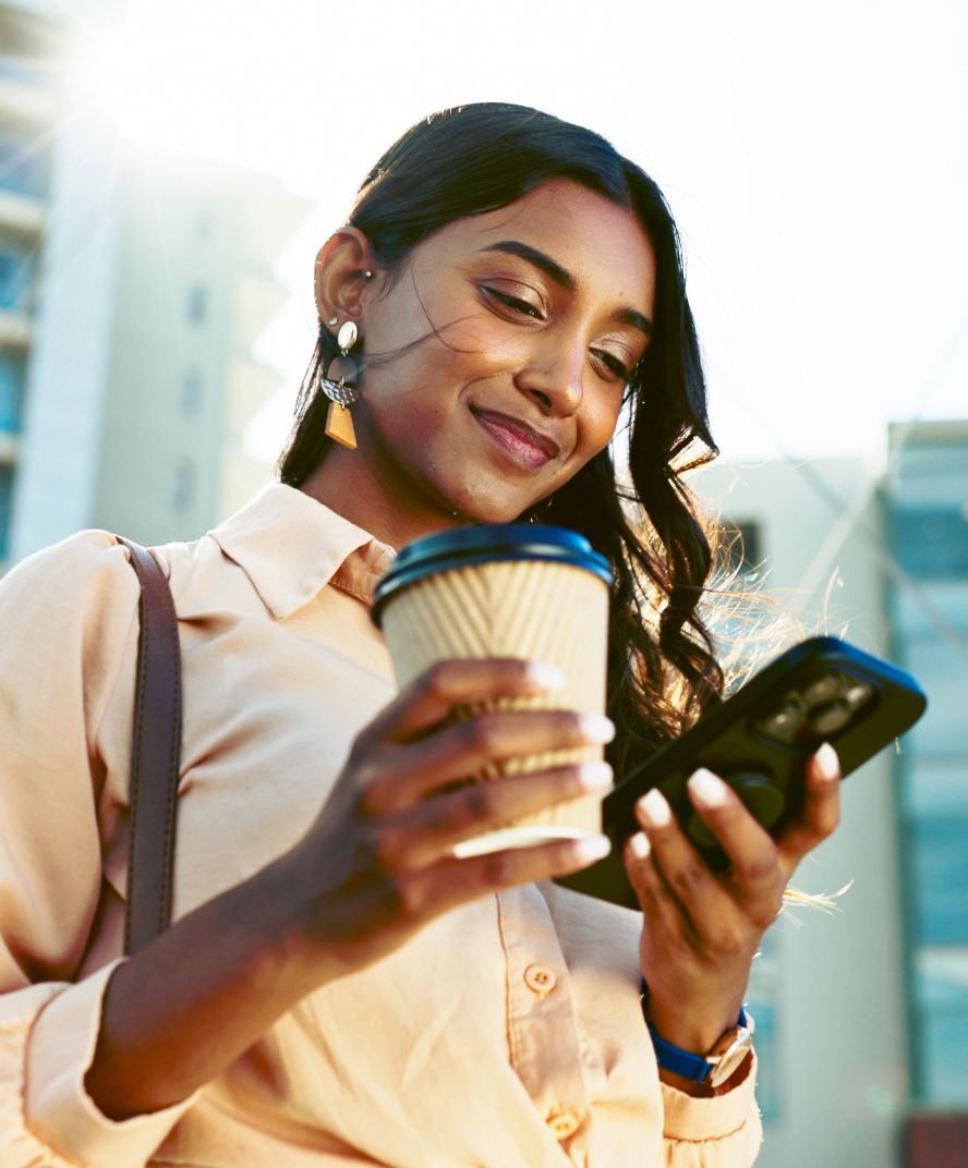 Woman on phone with coffee