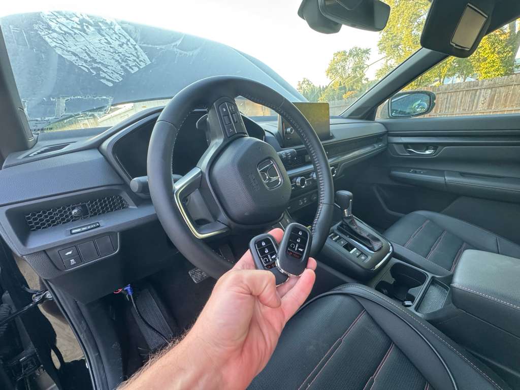 Pair of programmed key fobs inside Honda vehicle – car key fob replacement service