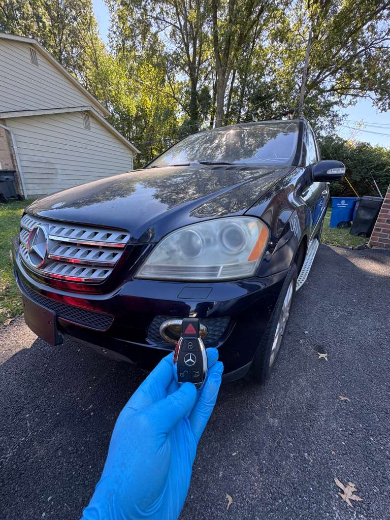 Hand holding Mercedes key fob