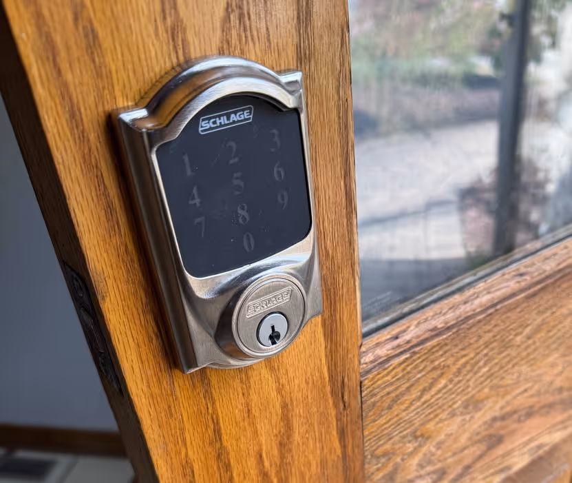 Schlage keypad smart lock installed on a wooden door