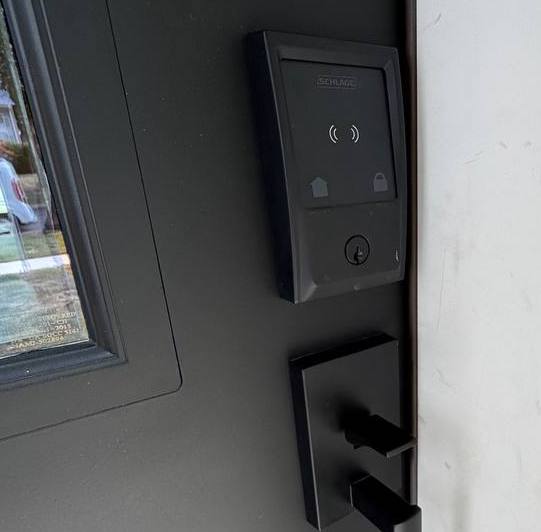 Smart lock installation on modern front door