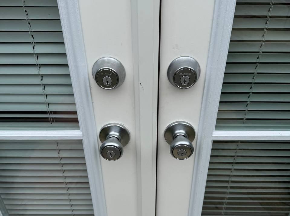 Paired deadbolt locks installed on double exterior doors