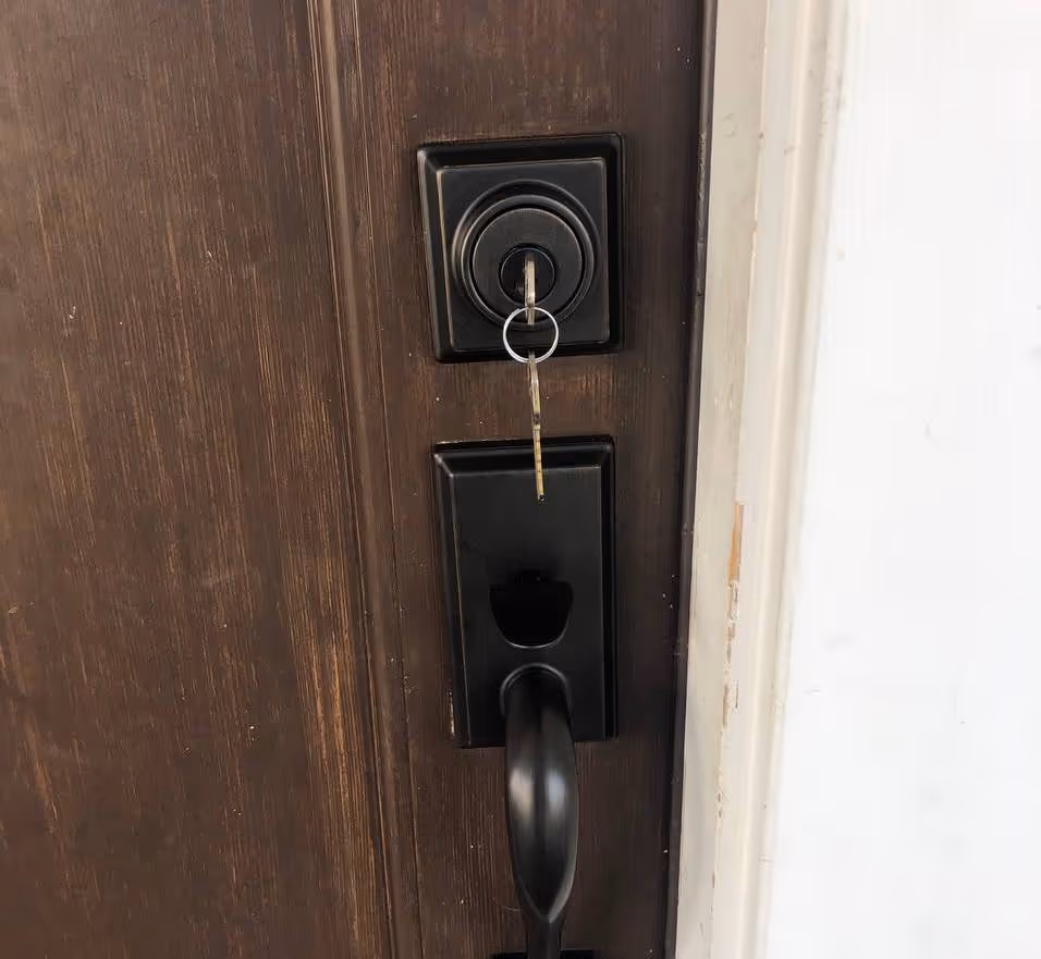 Deadbolt and entry handle on a door keyed into a master key system