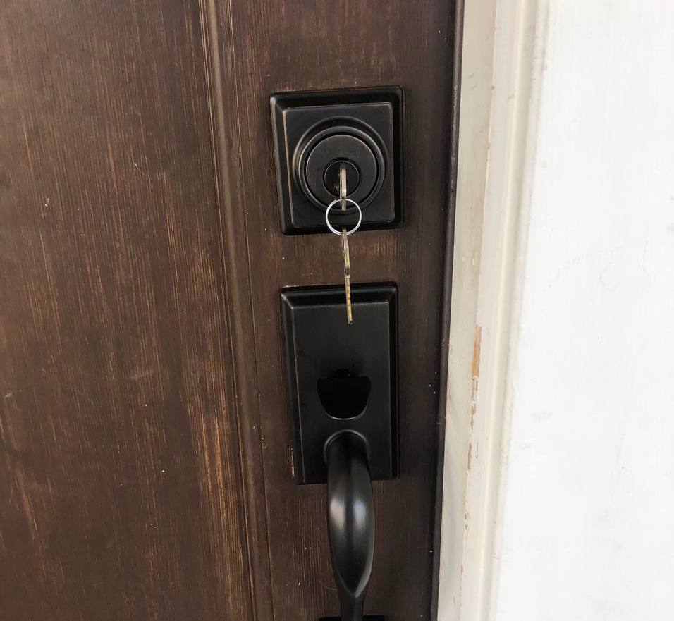 Deadbolt and entry handle on a door keyed into a master key system
