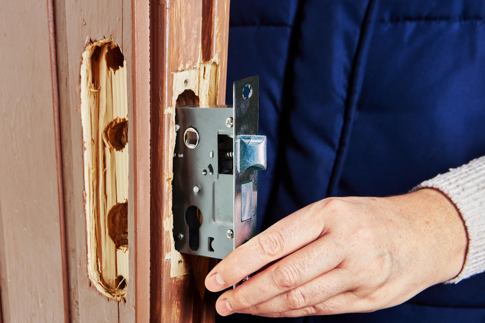 Installing new commercial door lock mechanism in wood door