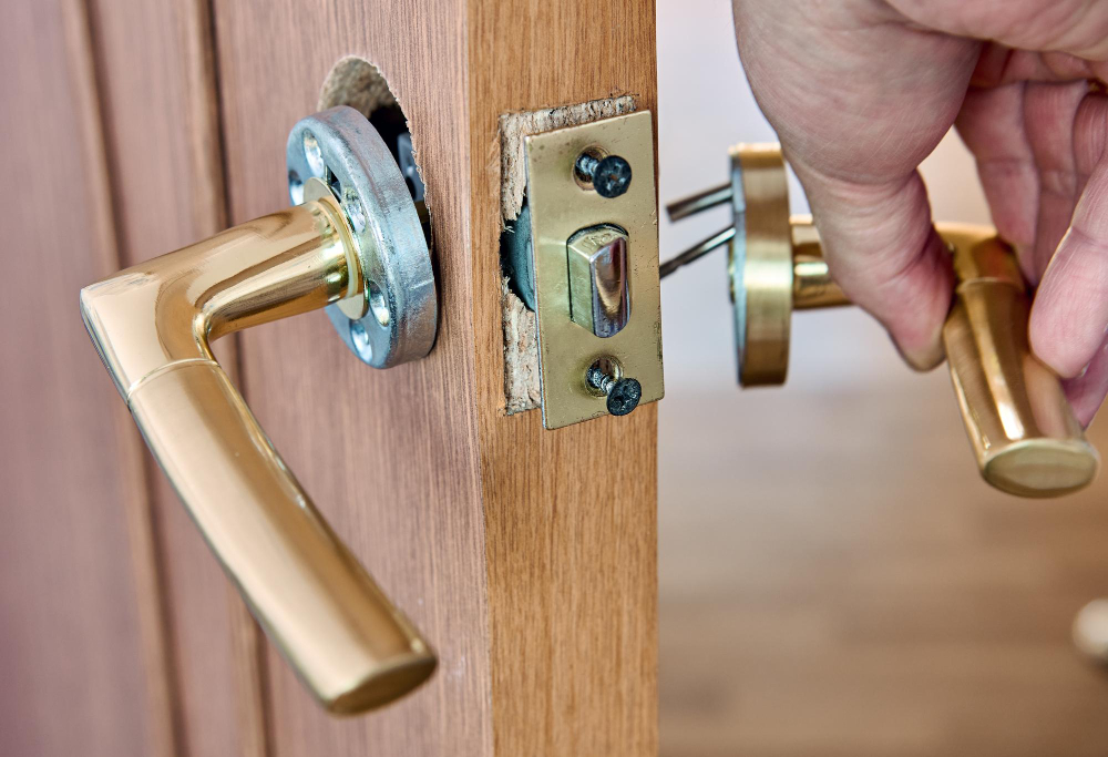 Commercial lock replacement and handle installation close-up