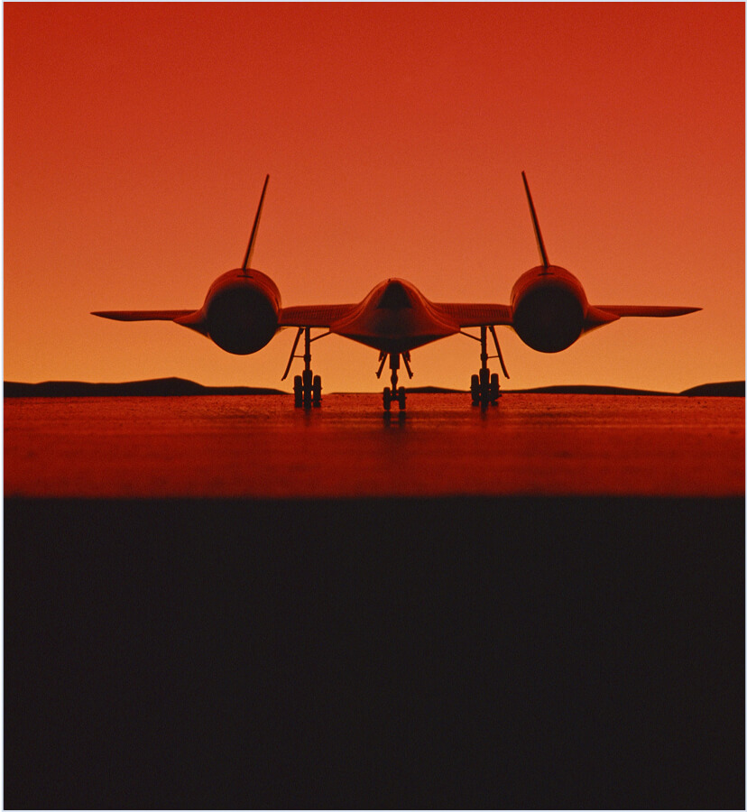 Defense aircraft on runway at dusk