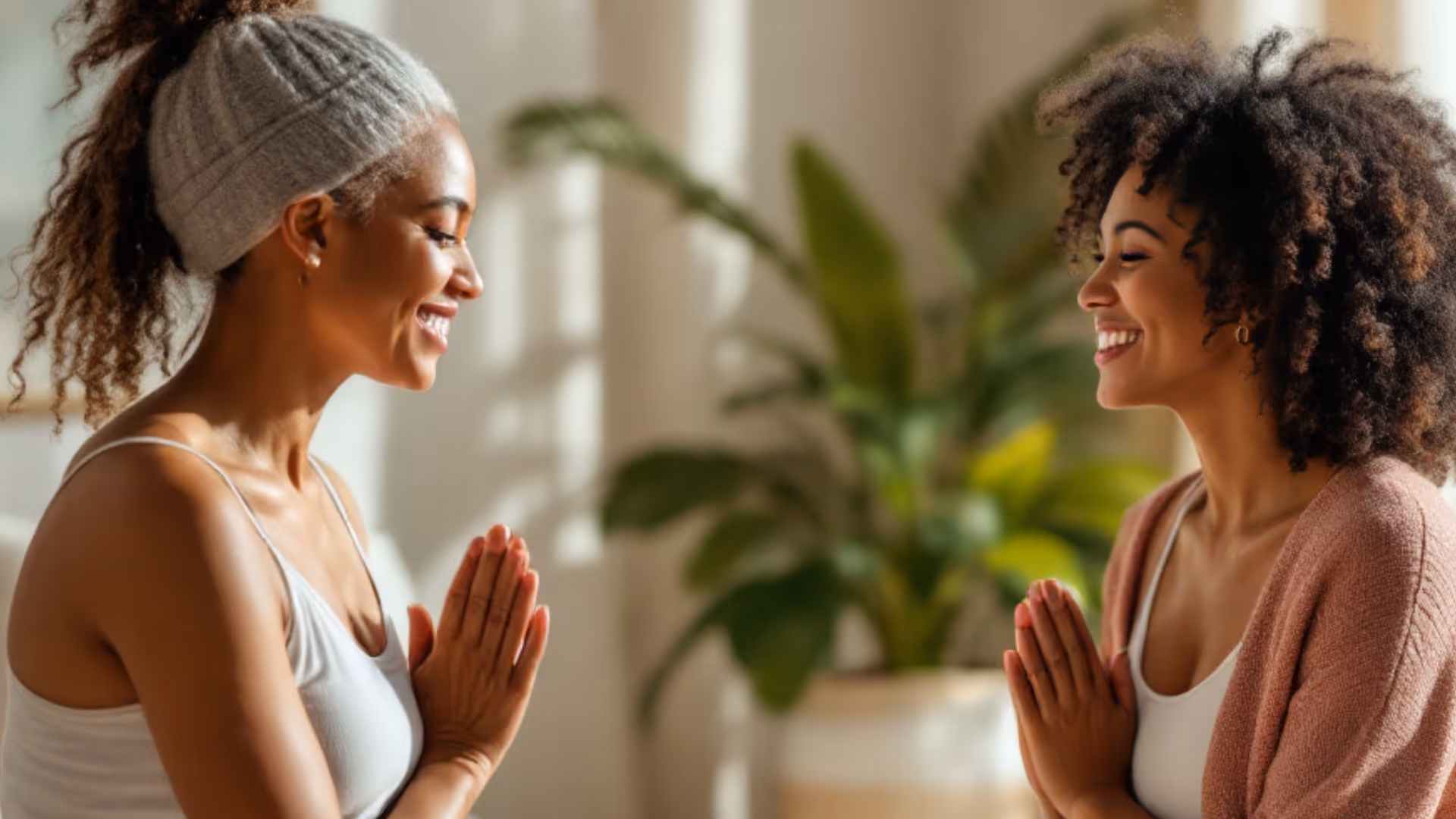 Private gentle yoga session between two women.