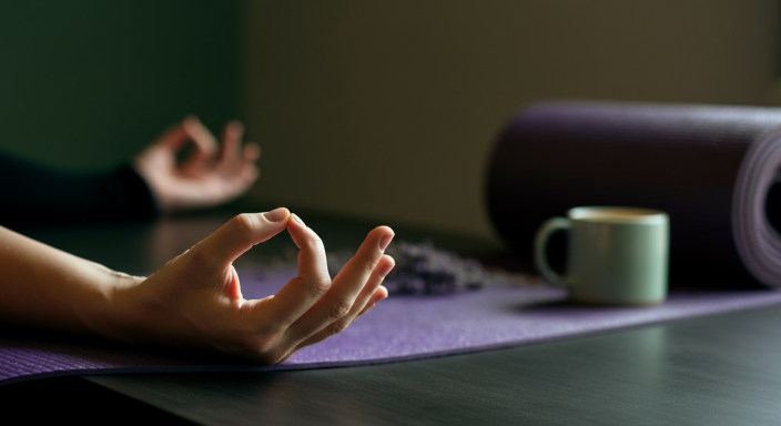 a person taking yogan and meditation  in their work