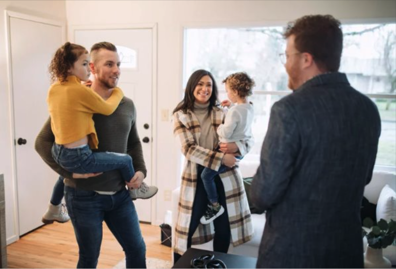Family buying their first home with realtor agent - Cityscape