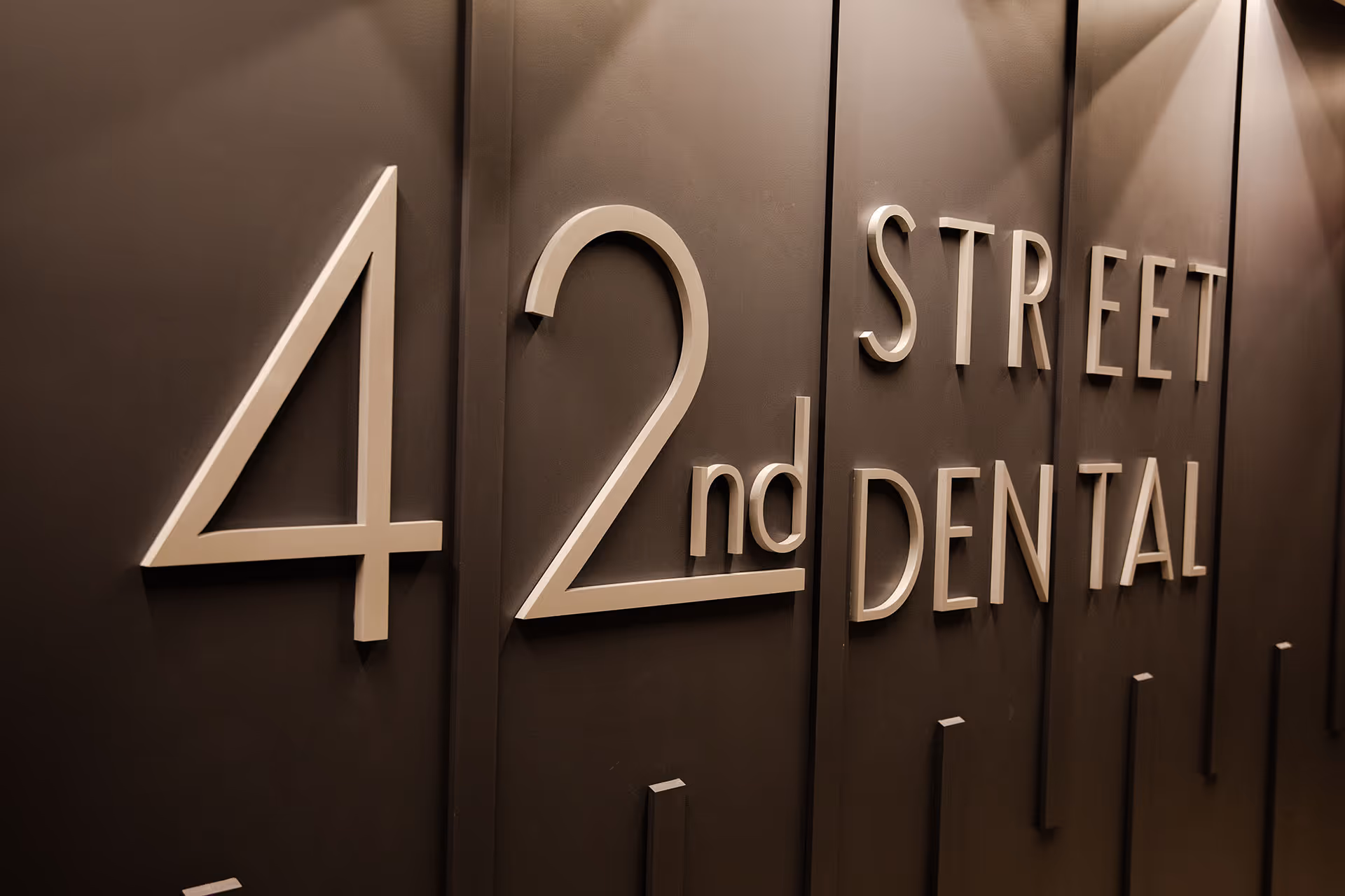 Entrance sign for 42nd Street Dental Office.