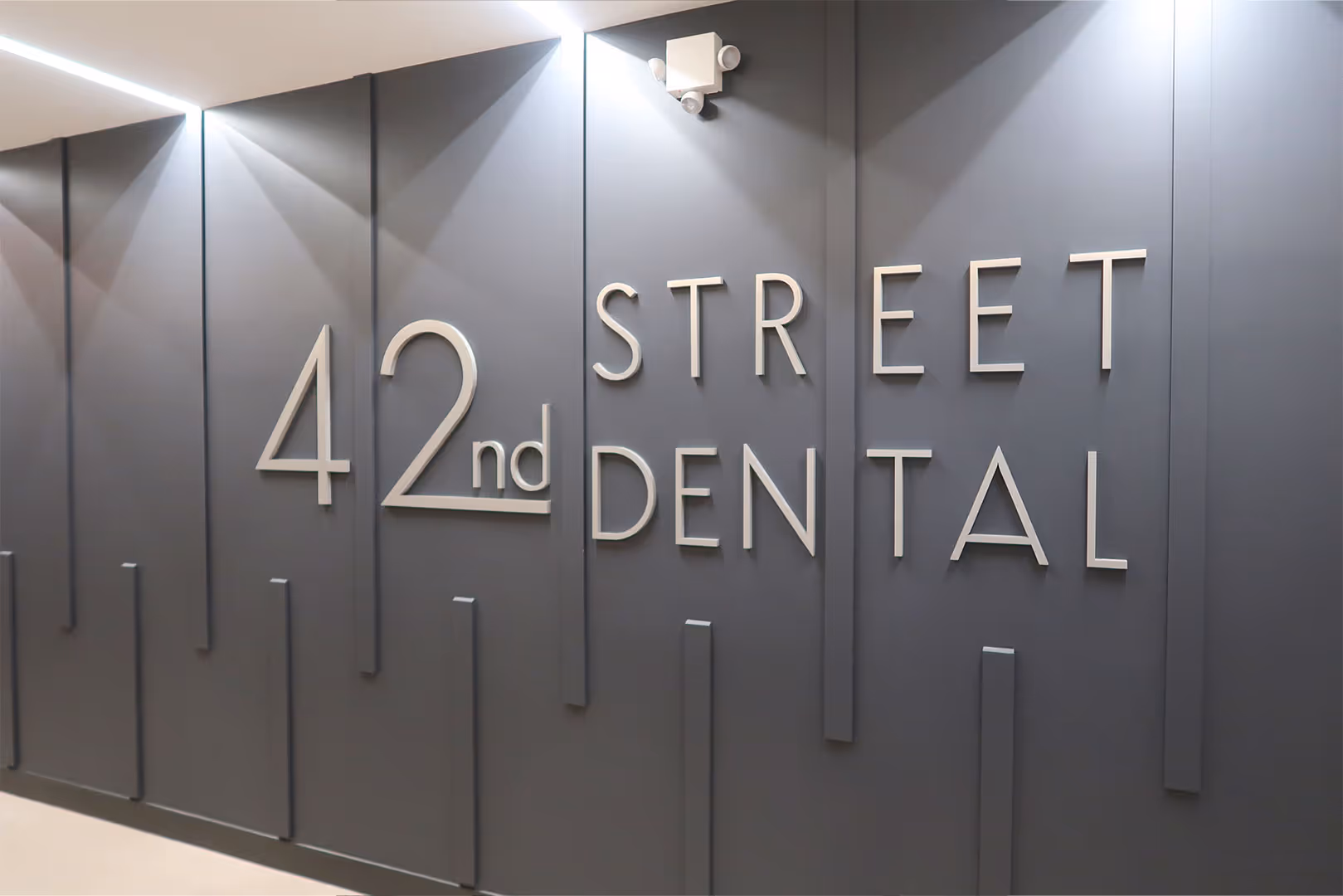 Entrance sign for 42nd Street Dental Office.