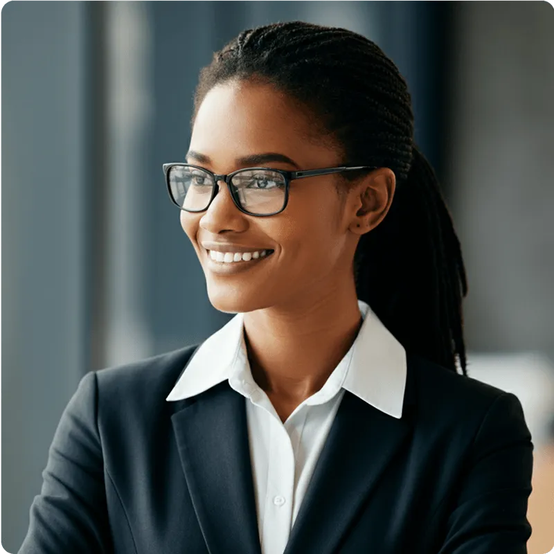 Woman in suite with glasses smilling