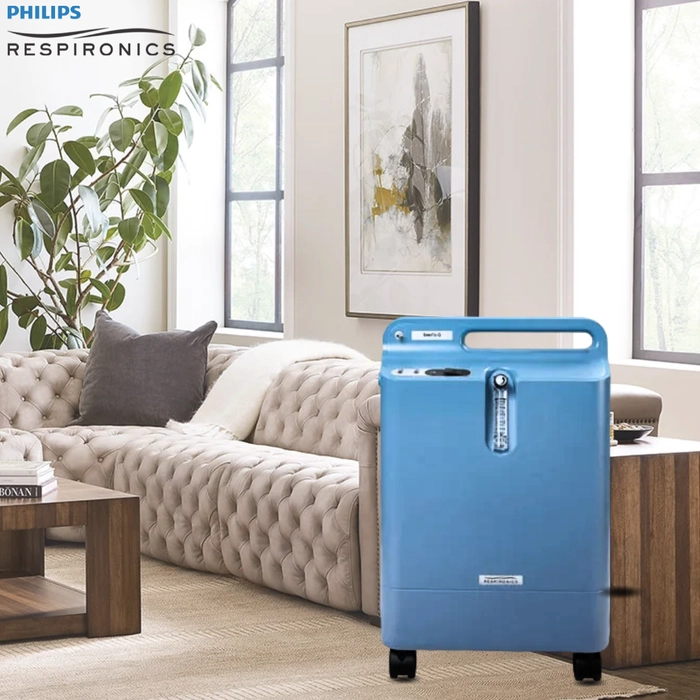 Philips Respironics oxygen concentrator in a modern living room setting