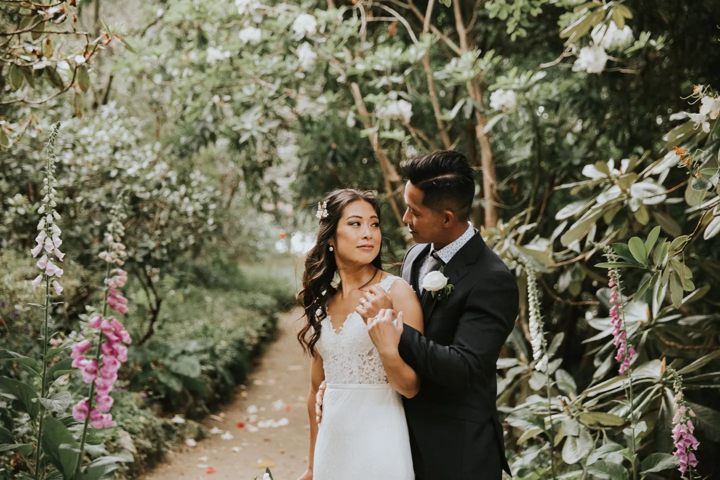 Newly weds pose for picture at Glenfalloch Gardens