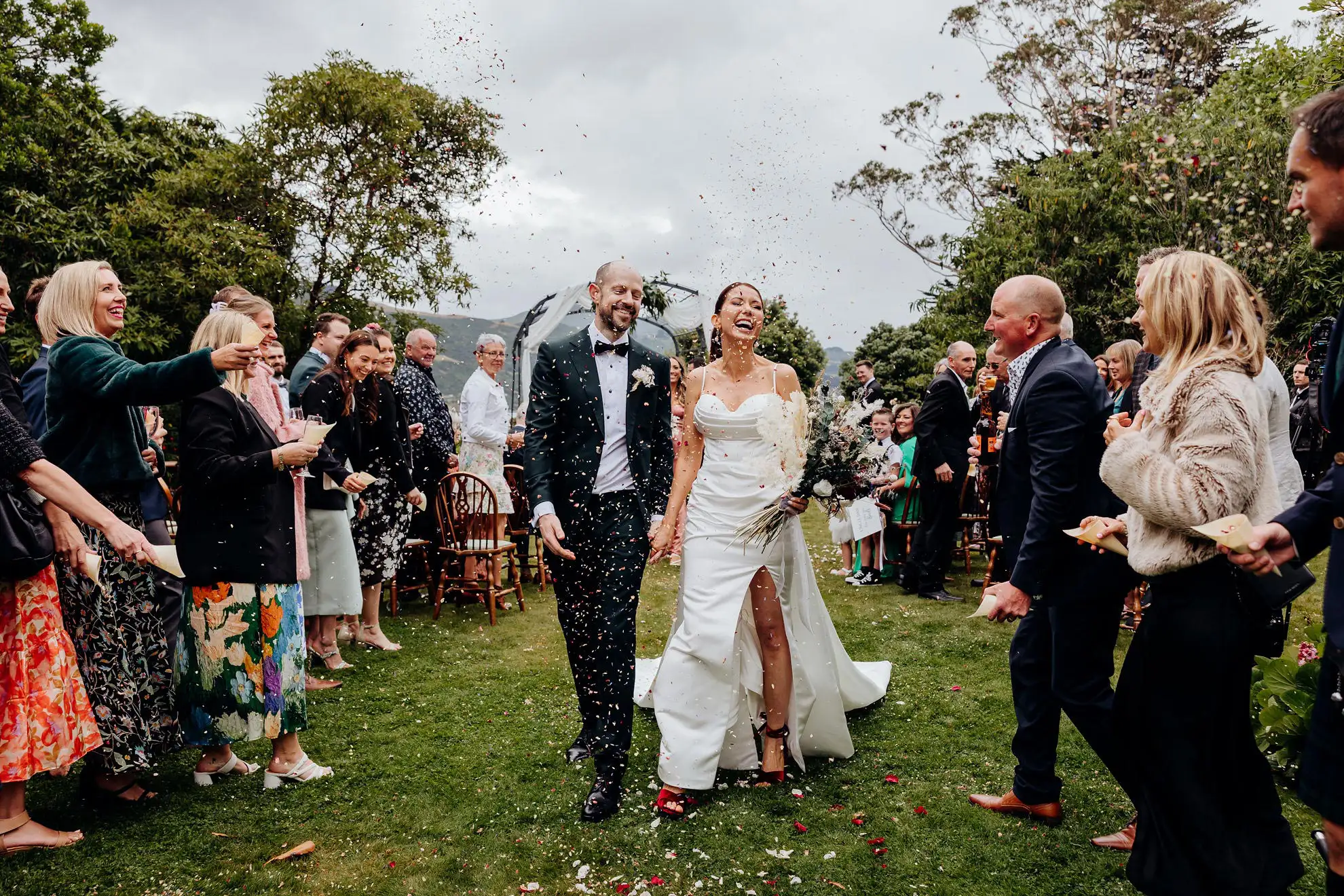 Newly weds walk down garden isle at Glenfalloch in Dunedin
