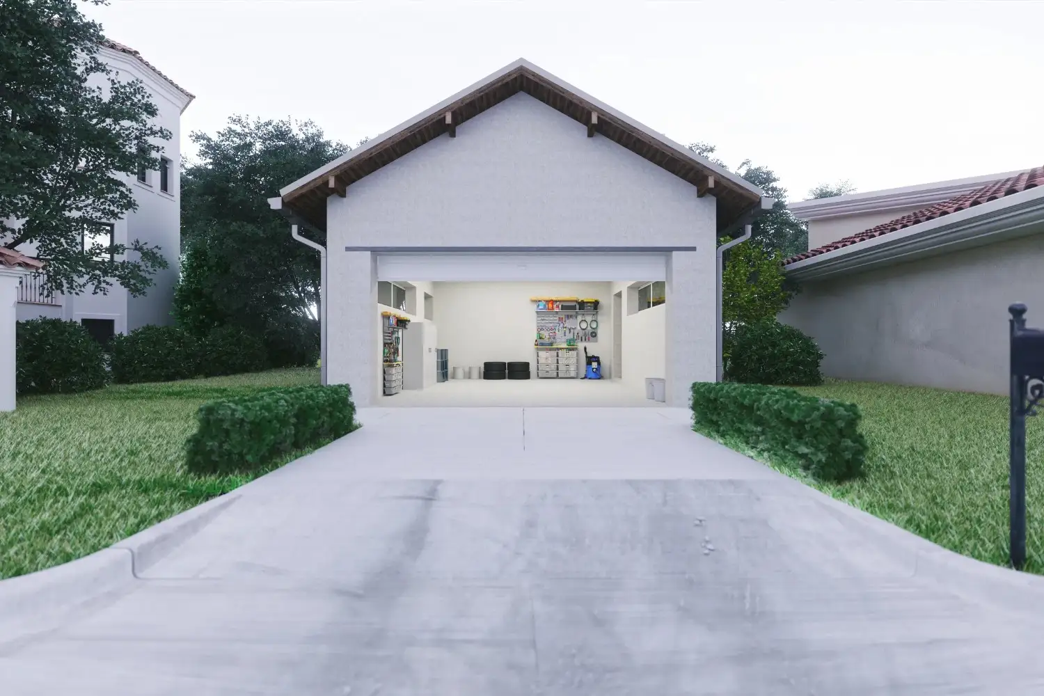 An exterior view of a white, modern garage with a paved driveway and green bushes, showing an organized interior with a workbench and storage.