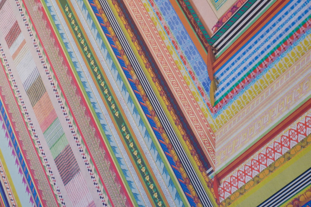 Close-up of different high-quality awning fabric swatches in various colors and patterns. - awning installation hagerstown md